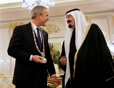 Bush holds the King Abdul Aziz Order of Merit medal