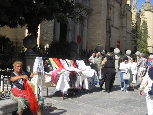 Gypsies selling wares at cathedral